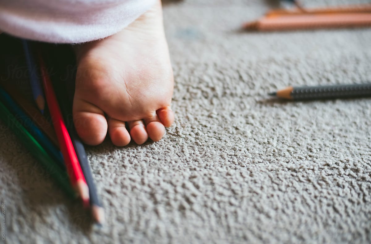 Child foot close to pens