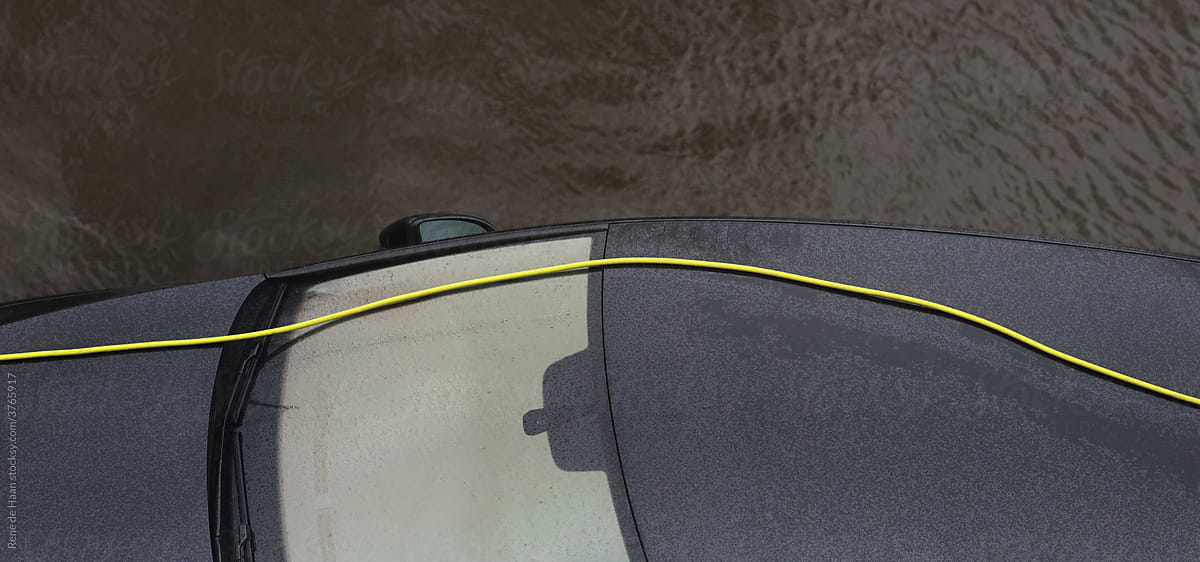 roof of car with yellow cable