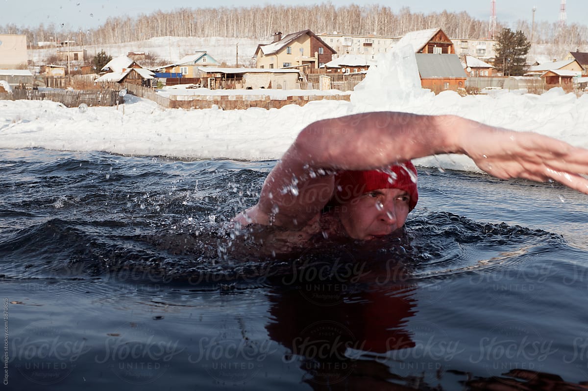 Athlete swimming in icy water