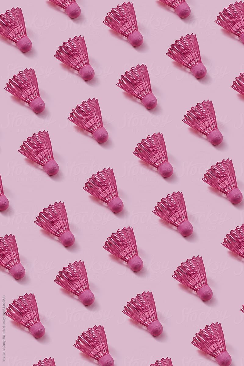 Pink colored plastic shuttlecocks pattern.