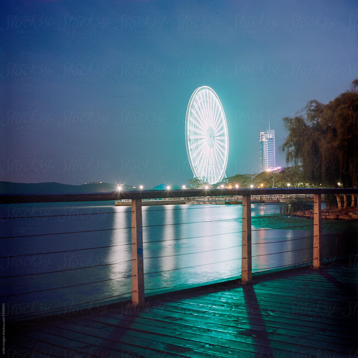 illuminated big ferris wheel standing by the Li lake,Wuxi city
