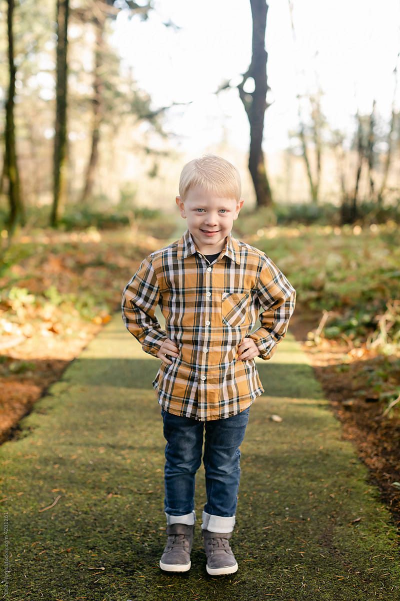Free Photos - A Young Boy Standing In Front Of A Grey Background, Wearing A  Green And Black Plaid Shirt And Sneakers. He Is Striking A Pose And Appears  Quite Handsome. The