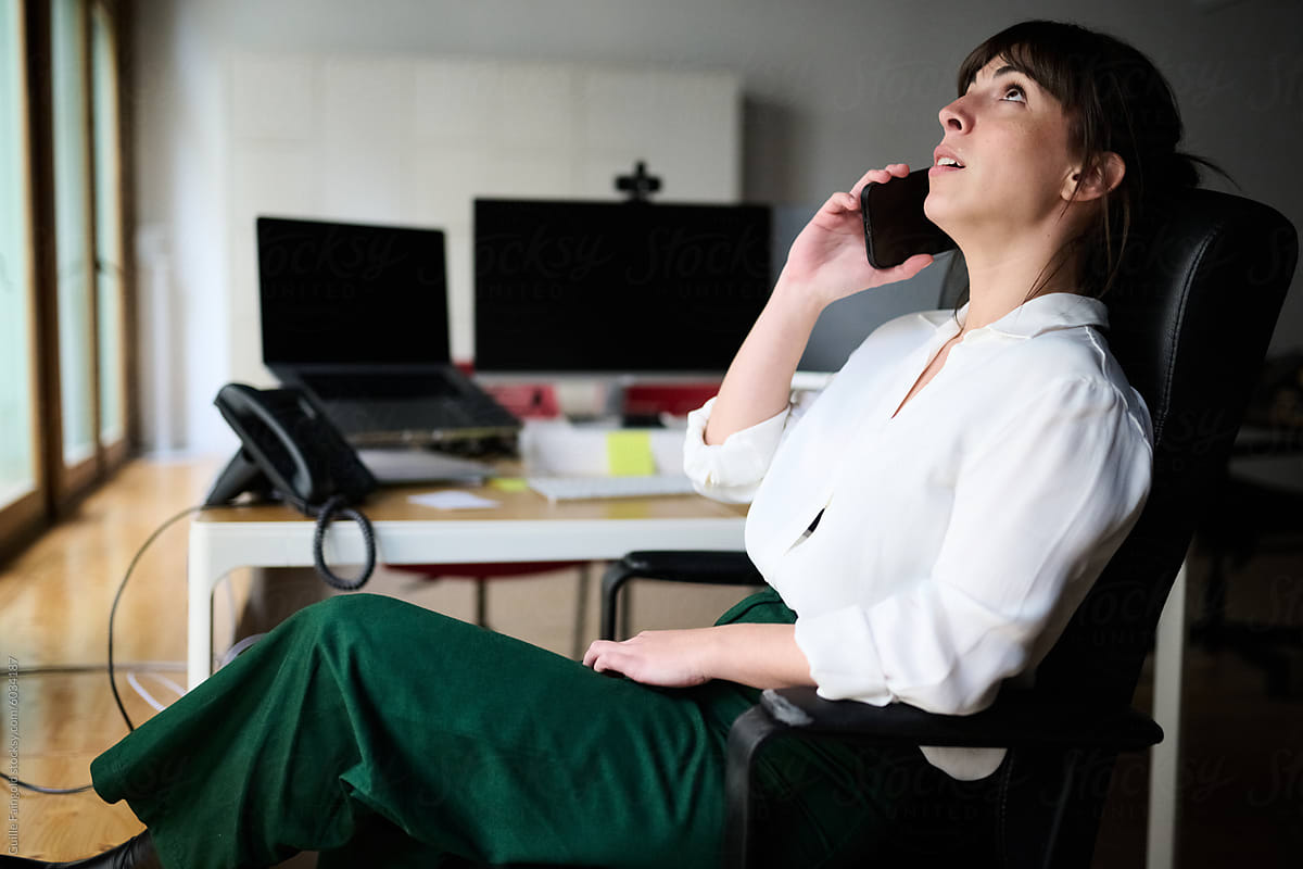 Businesswoman on Phone Call at Desk