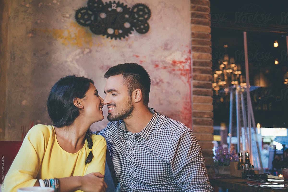 Couple In Love Kissing At A Cafe Del Colaborador De Stocksy Lumina Stocksy 