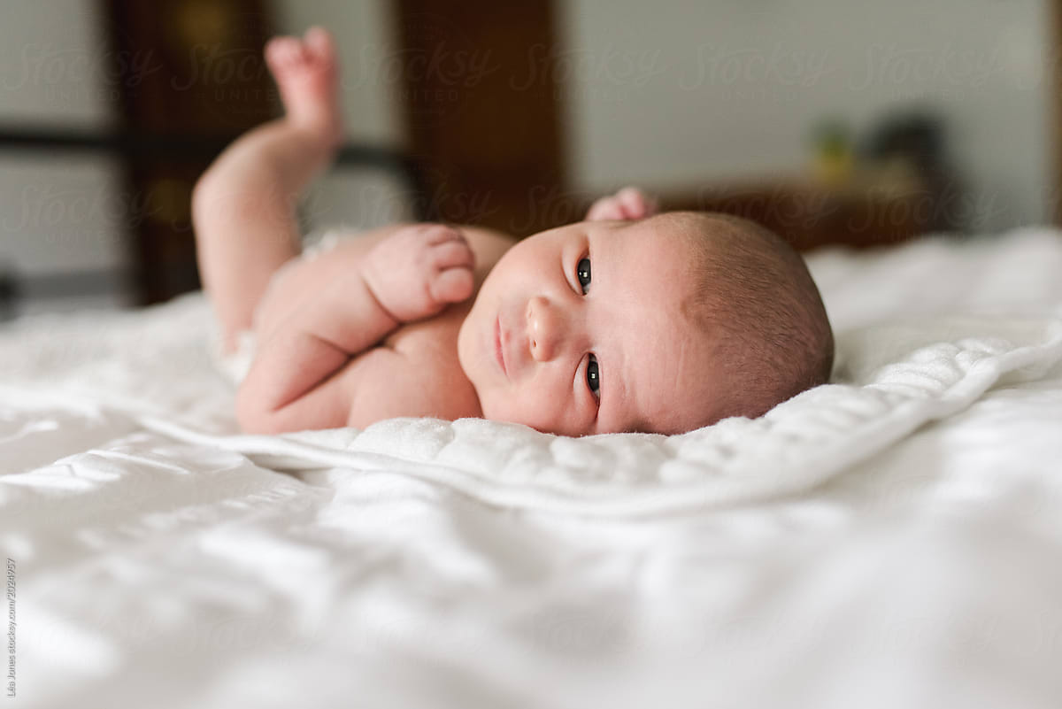 Newborn Baby Babe On Bed Del Colaborador De Stocksy Lea Jones Stocksy