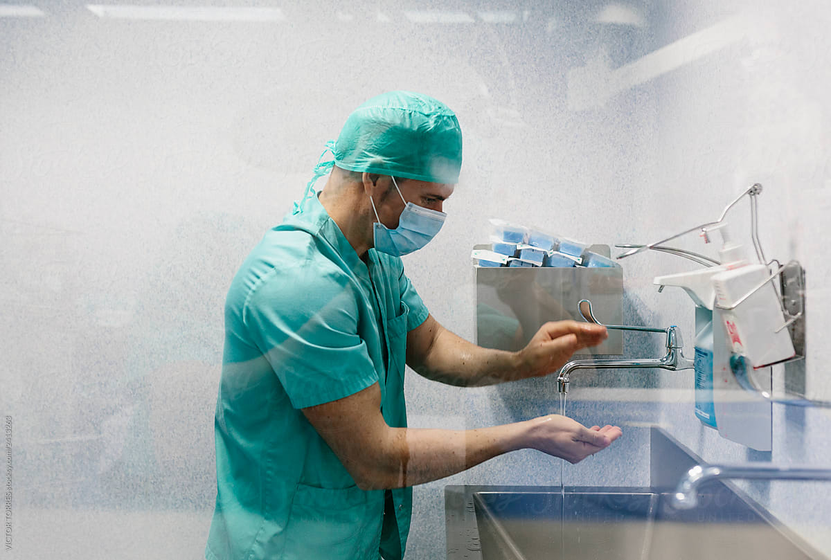 Doctor washing hands before a surgical intervention