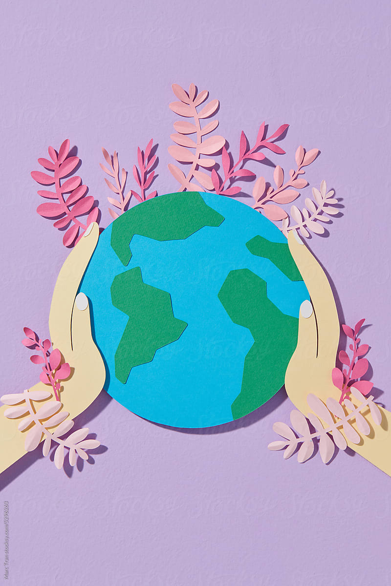 A globe with flowers in paper cut and craft style