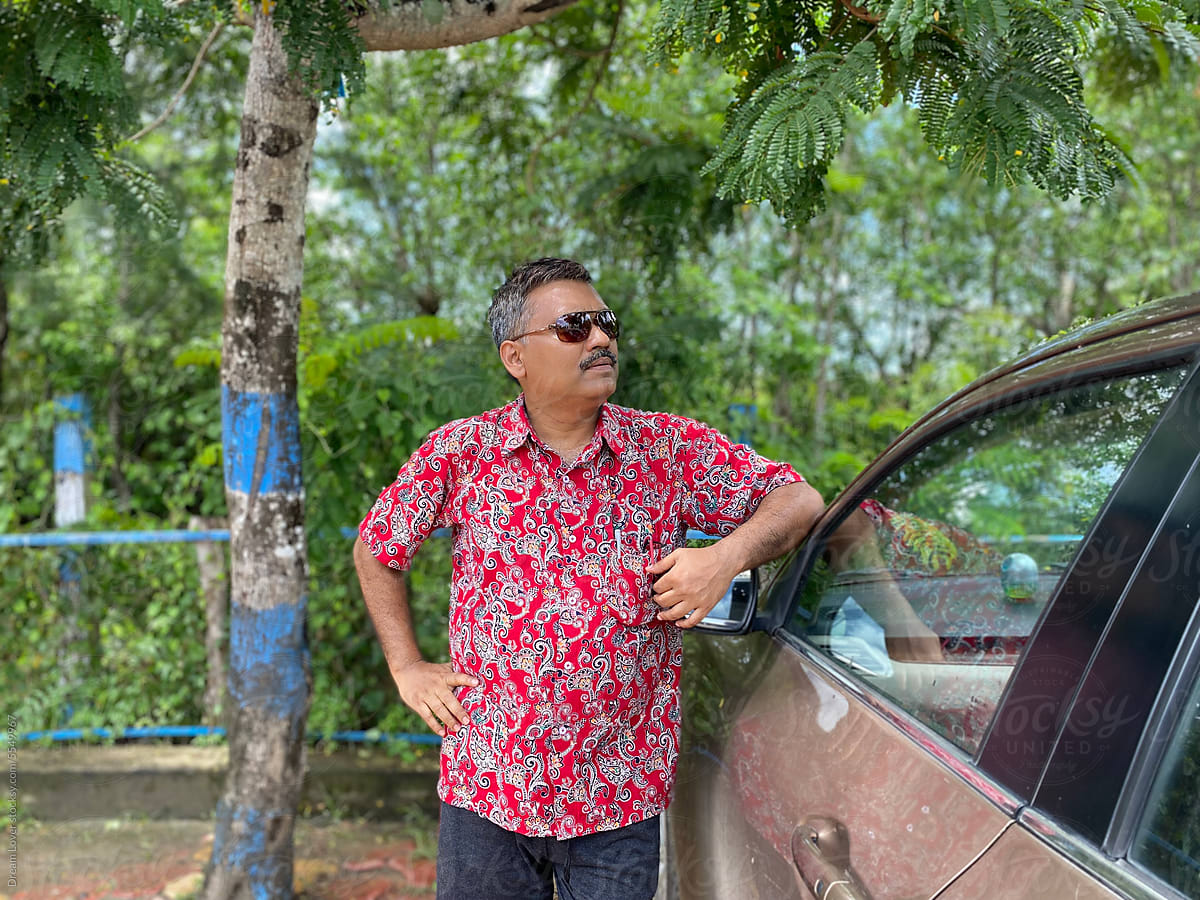 Portrait of a fashionable middle aged Indian man at outdoors