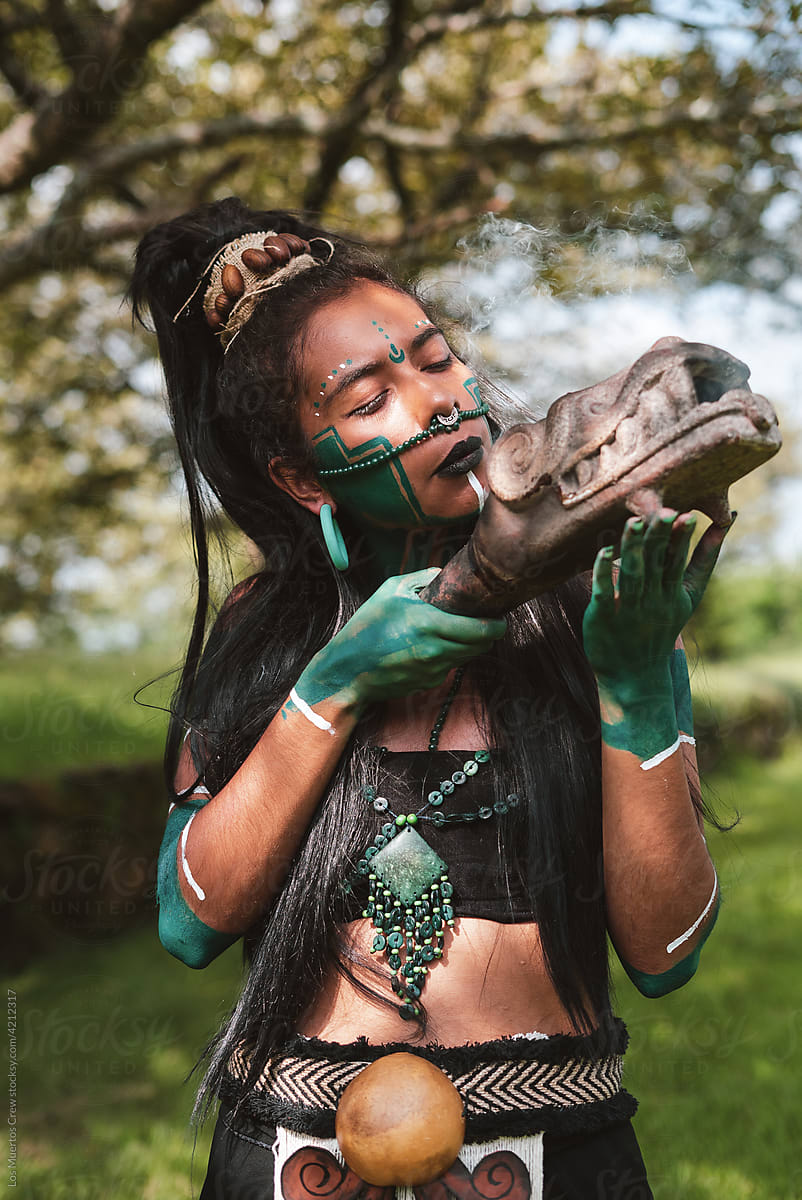 Mayan warrior performing smoke ceremony