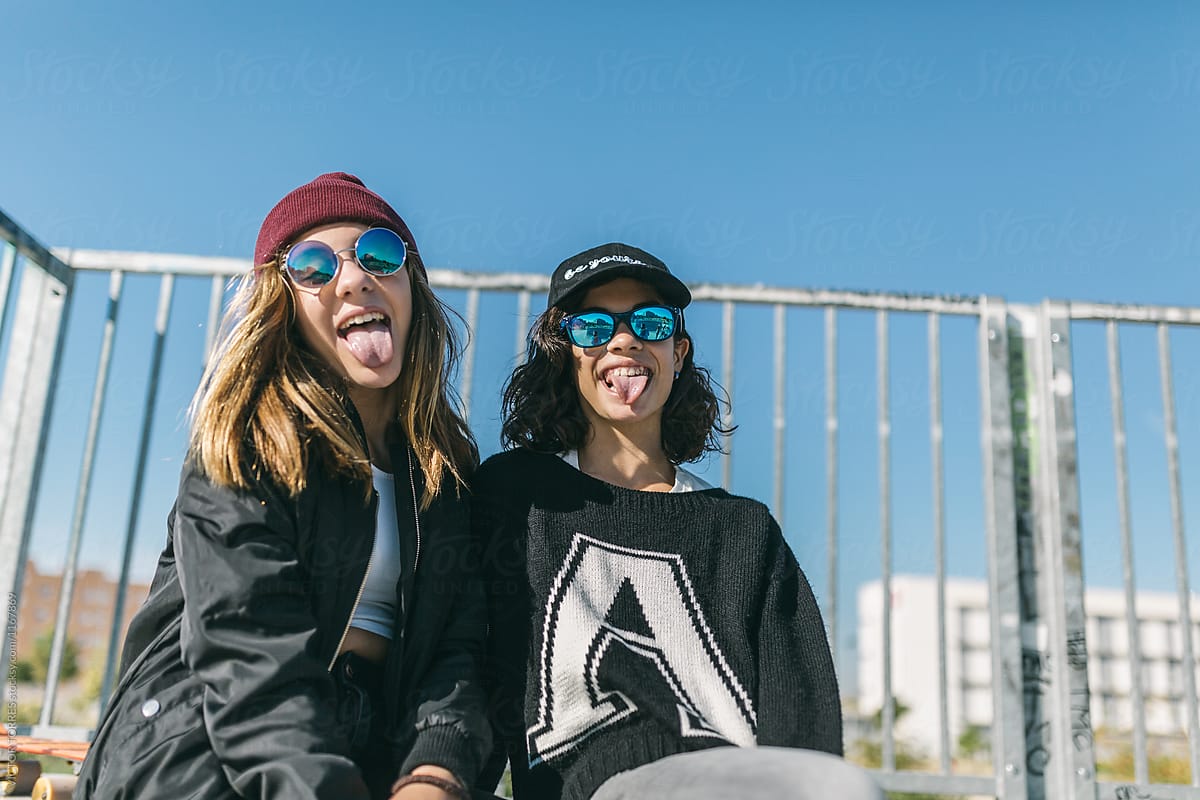 Three Teen Girls Showing Their Tongue To Camera by Stocksy Contributor  VICTOR TORRES - Stocksy