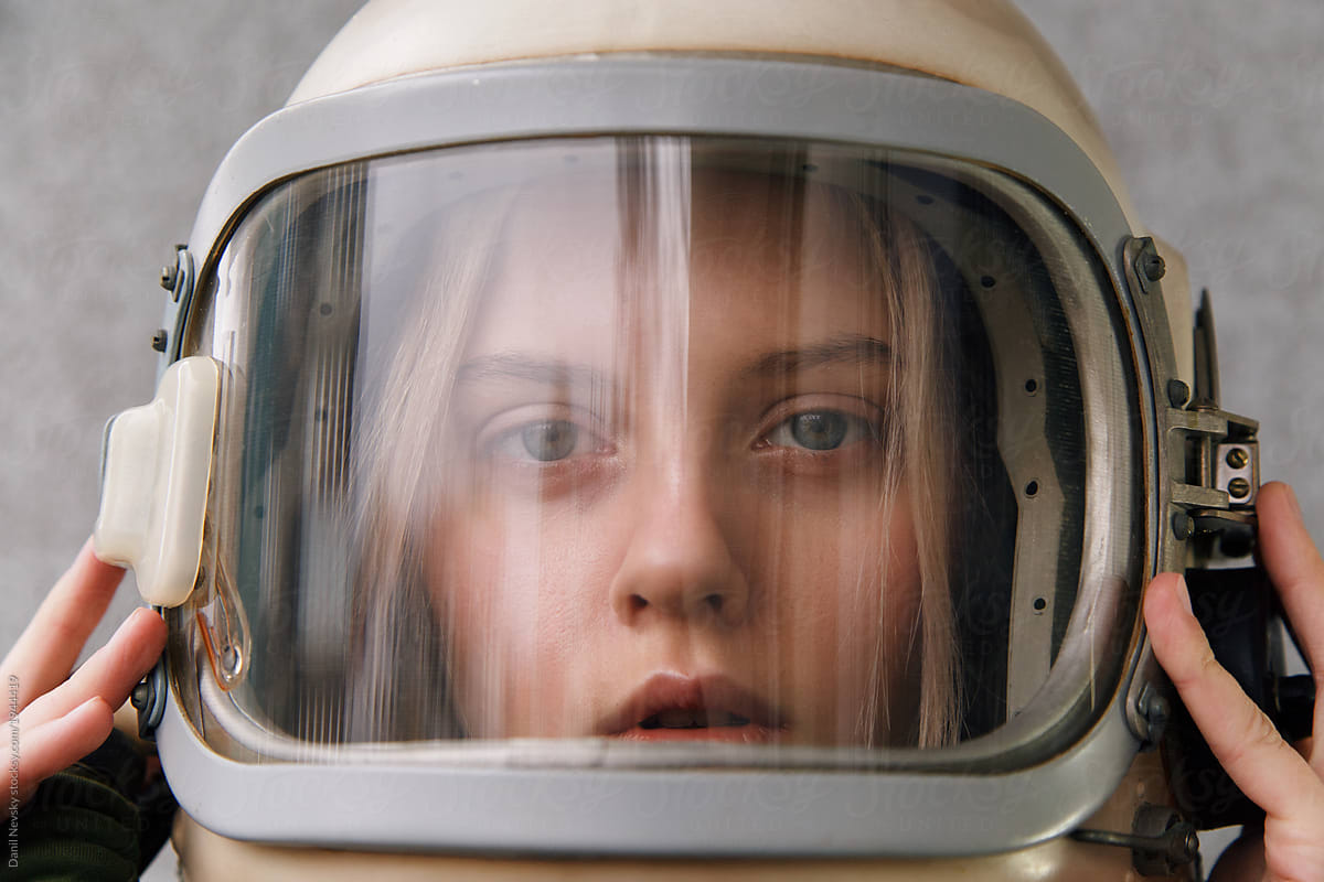 Sensual girl wearing retro space helmet