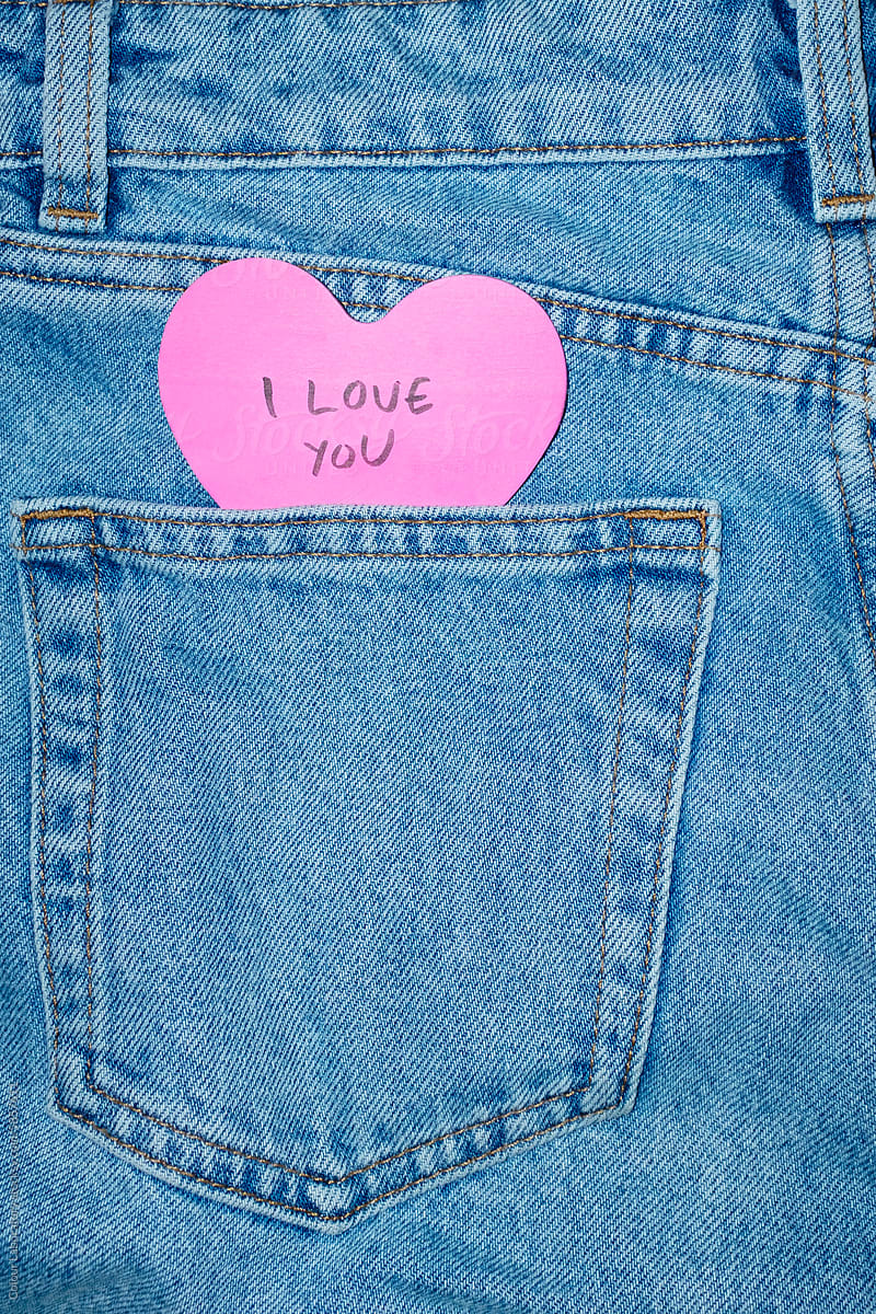 Classic blue jeans with heart-shaped post it note & 