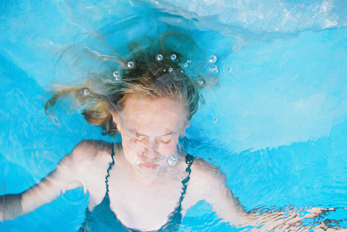 Blonde Girl Underwater In Blue Water By Stocksy Contributor Wendy