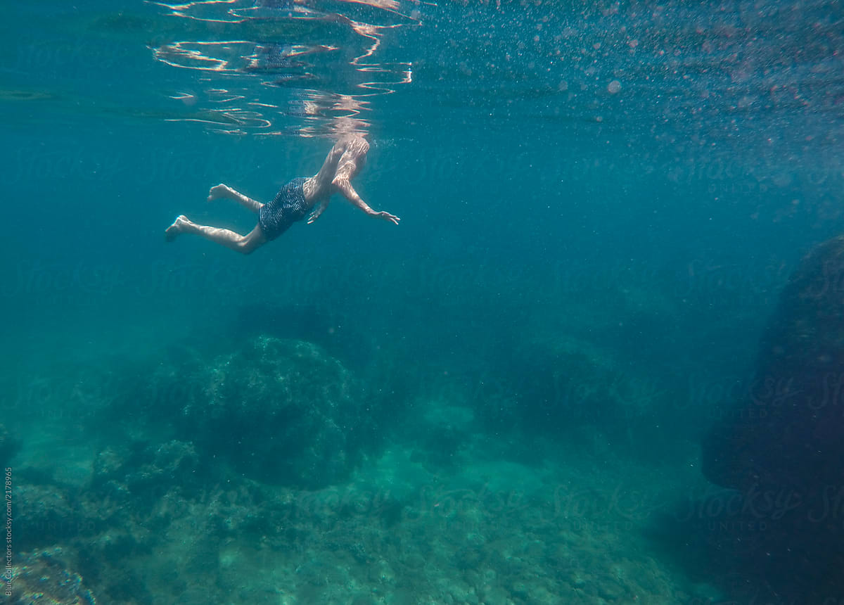 people swimming underwater