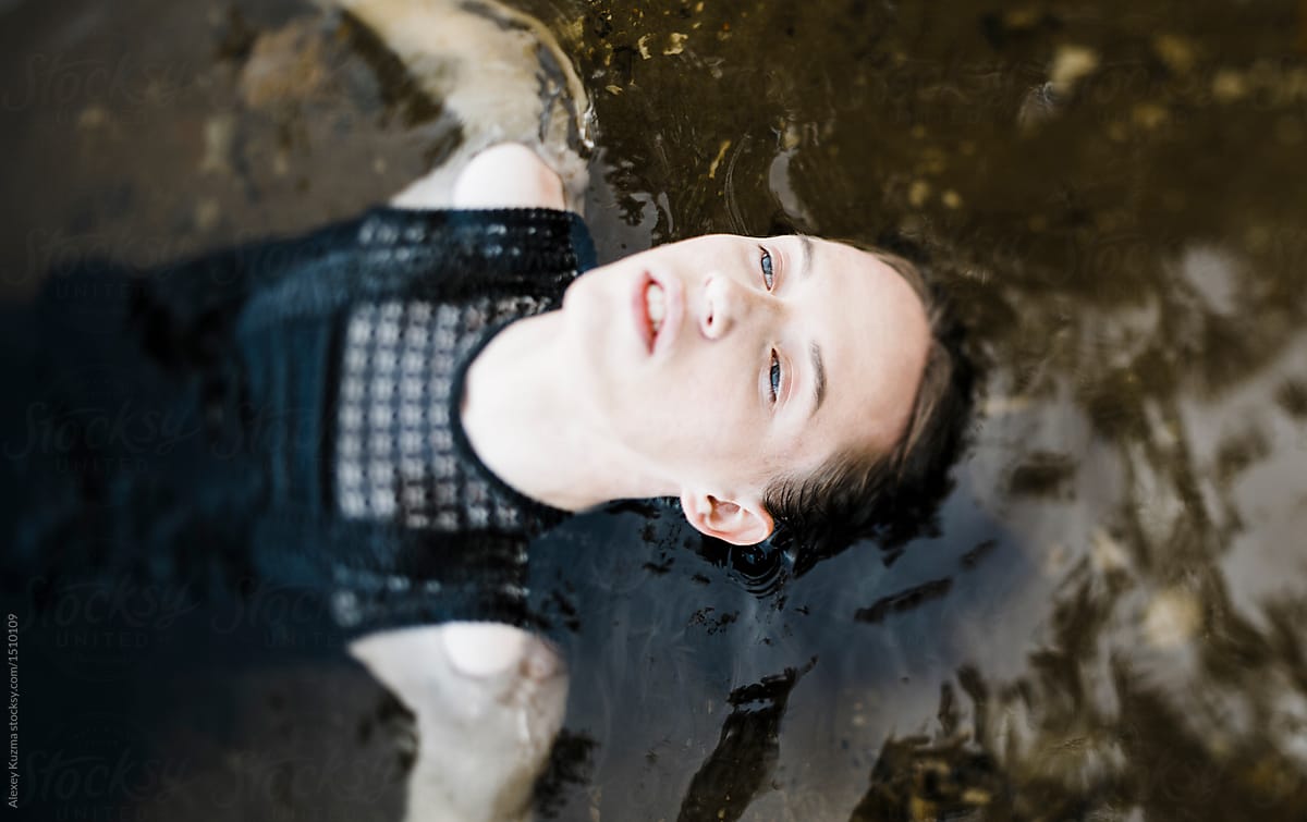 young androgyne man in the water