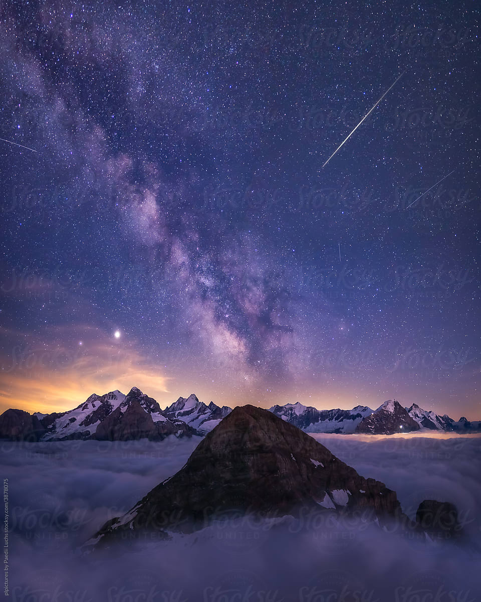Milky way and starry sky over the alps