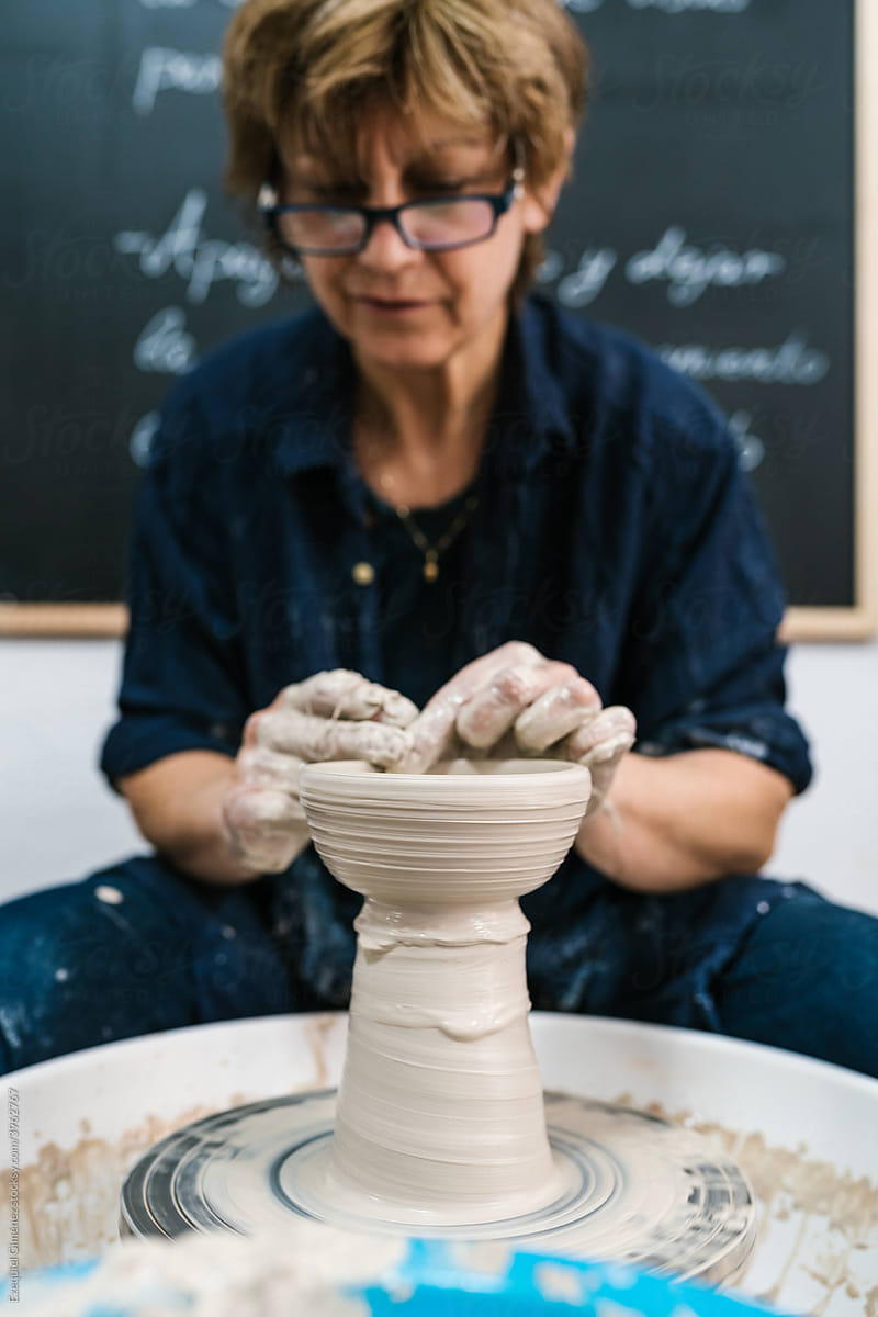 Woman potter at work in the pottery workshop