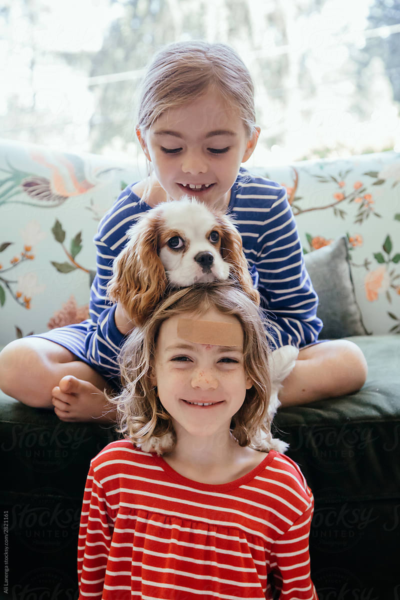 Two kids and a puppy
