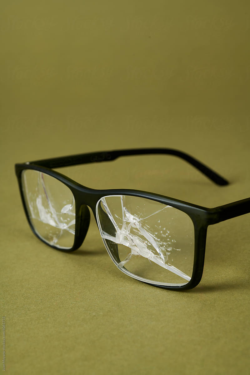 broken black plastic-rimmed glasses