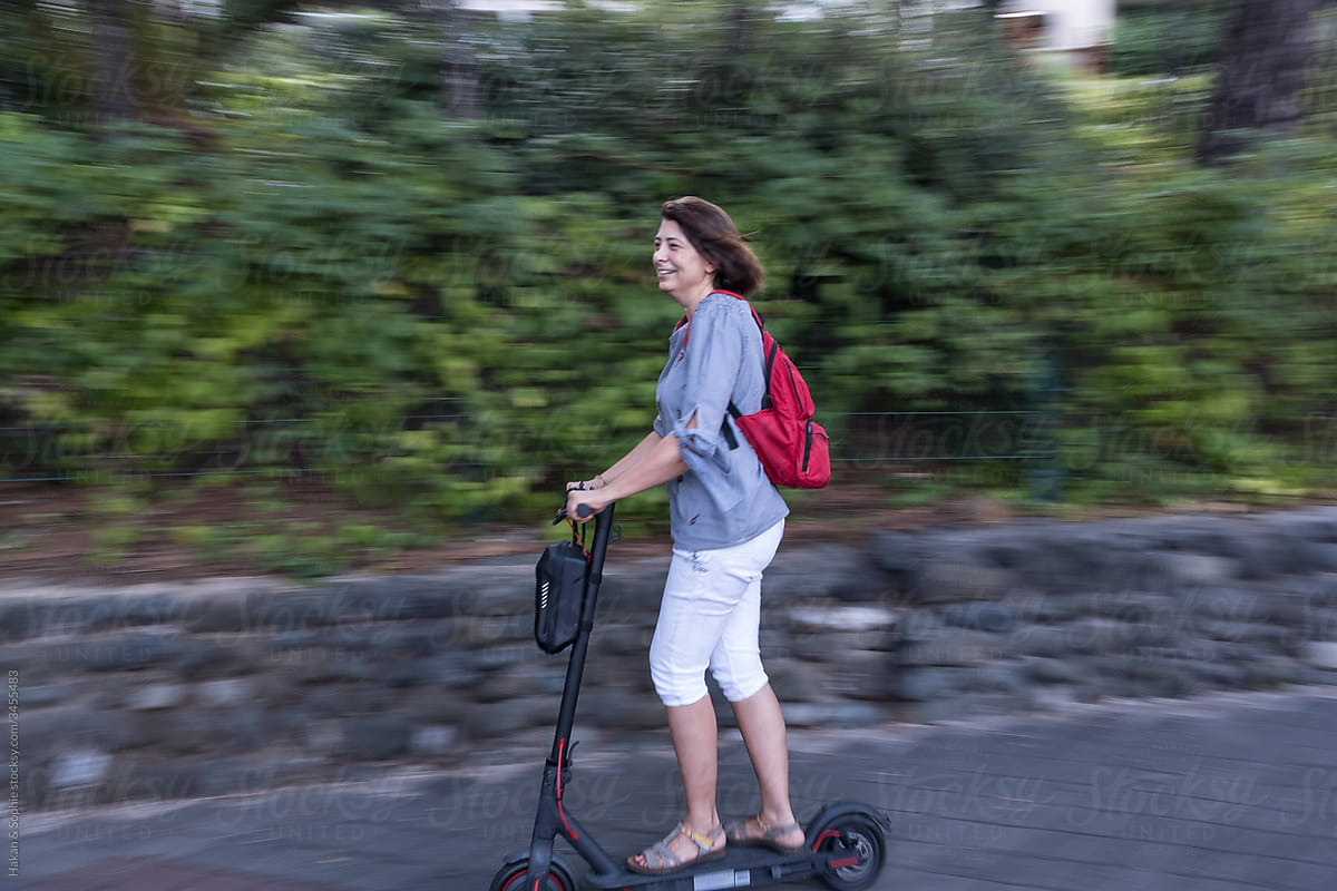 a middle aged woman on electric scooter