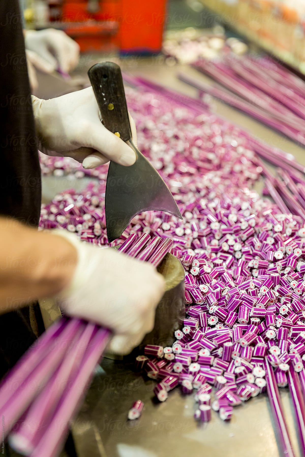 Cutting candy tubes  into final lengths for bagging
