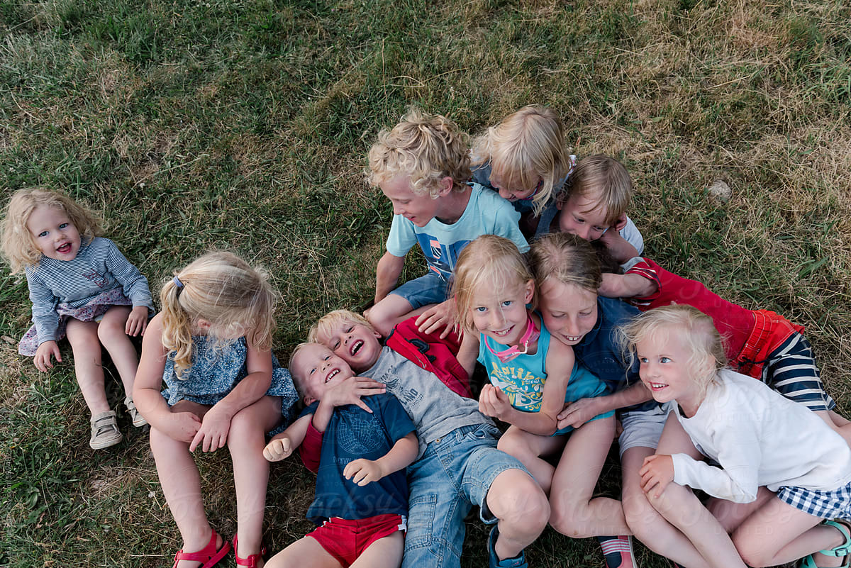 Eleven Cousins Hugging And Being Silly By Stocksy Contributor Léa