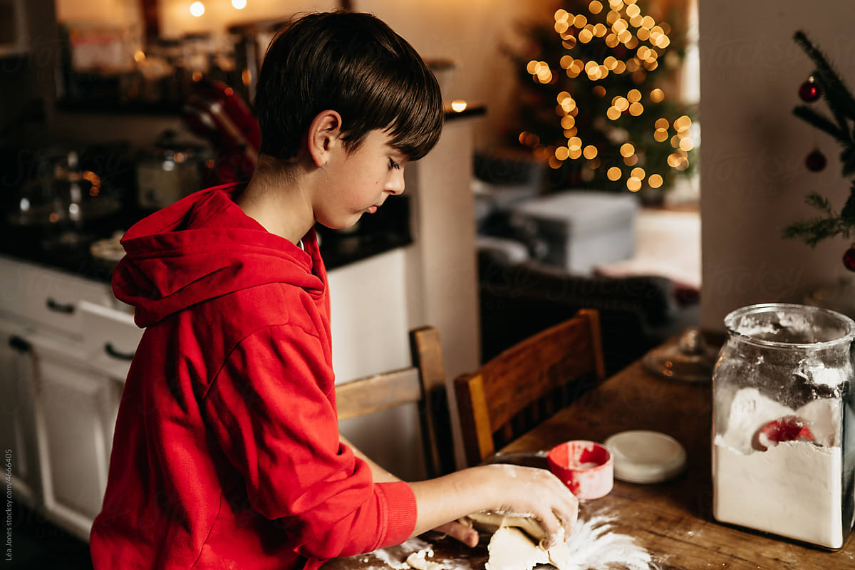 boy making shortbread cookies for Christmas
