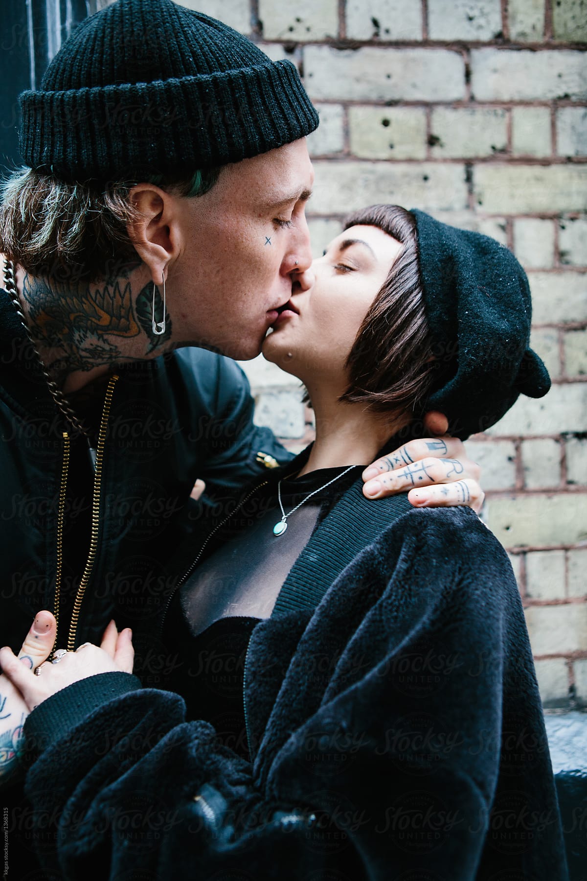 Attractive punk couple kissing