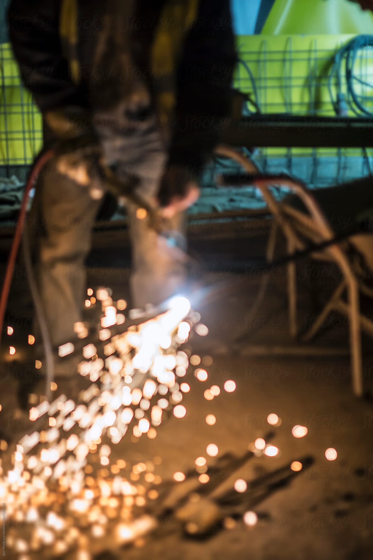 worker welding pipes atmosphere