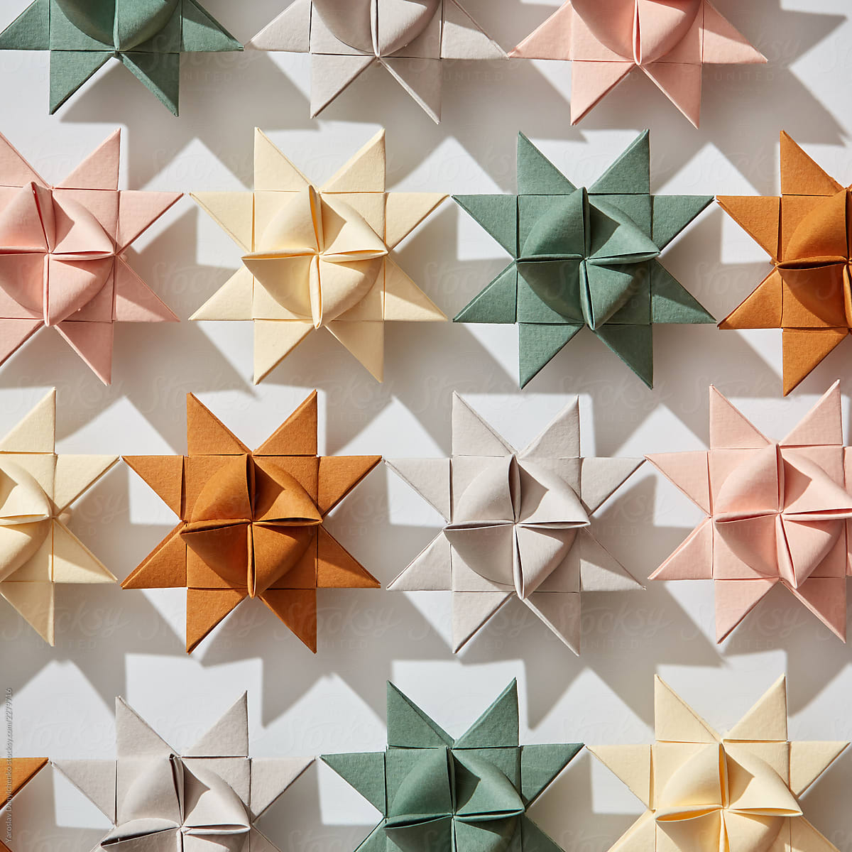 Pattern of multicolored paper origami Christmas stars