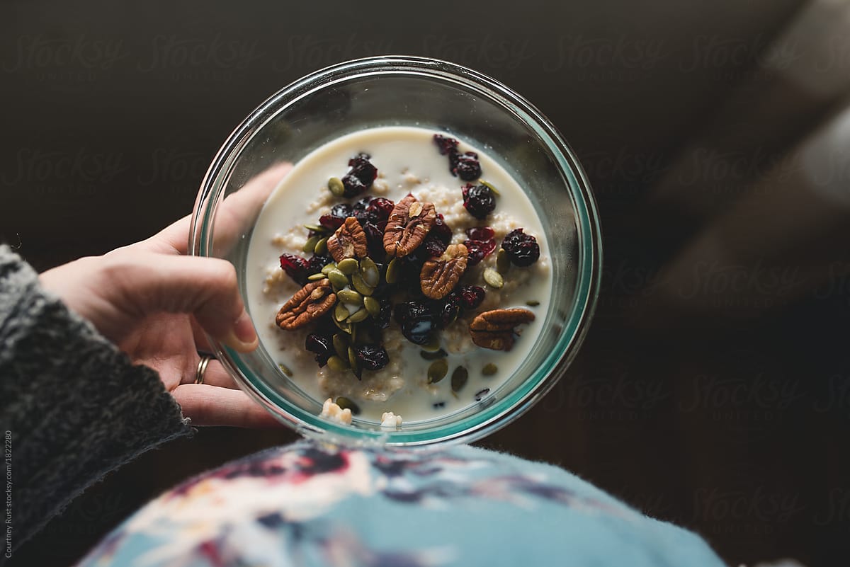 Pregnant woman holding a bowl of steel cut oats
