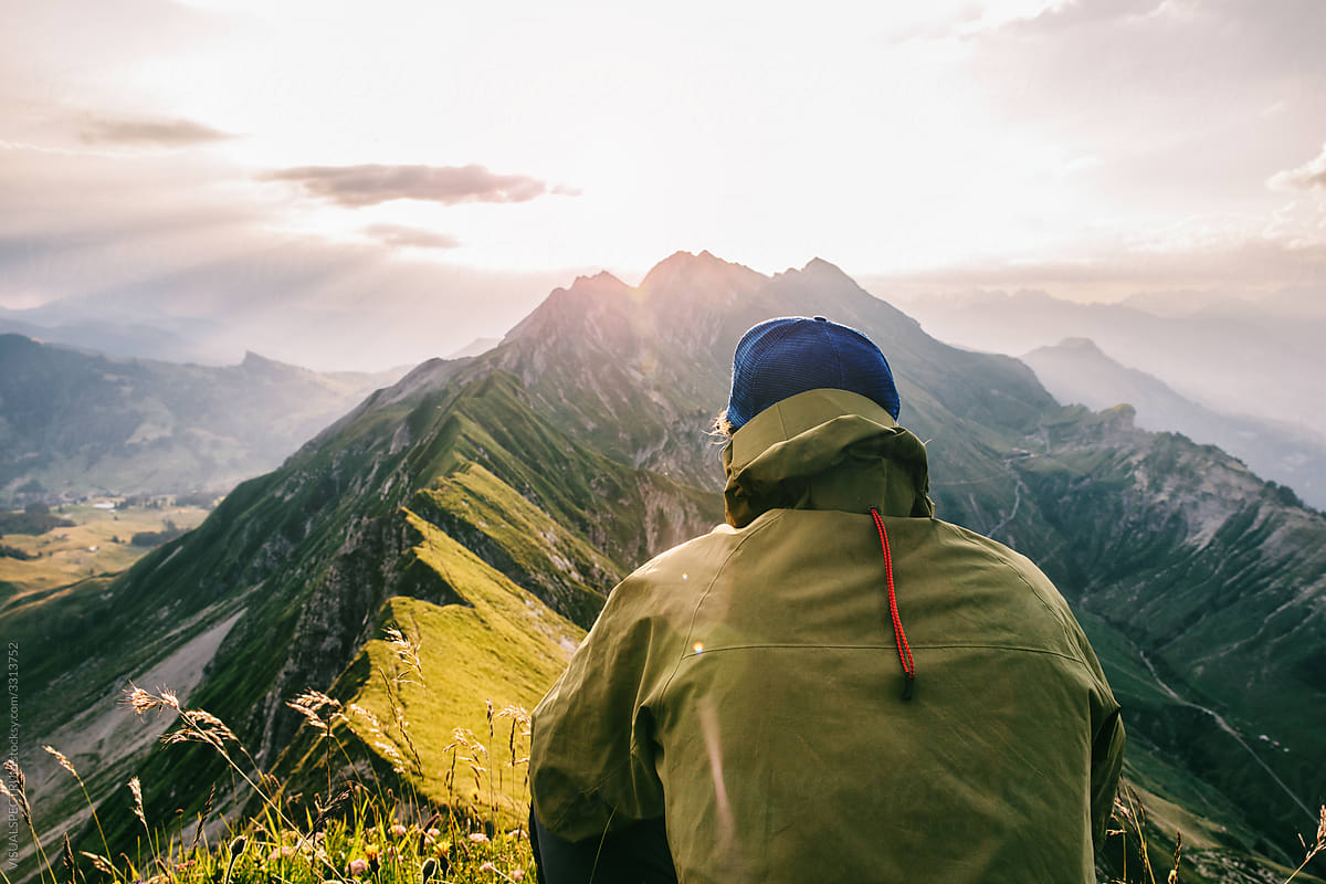 Faceless Male Hiker Watching Sunrise in Mountains