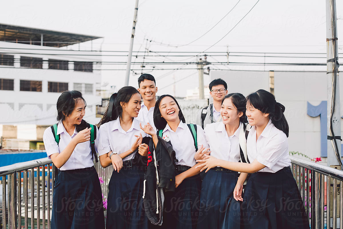 Thai students walking together on the bridge in Bangkok