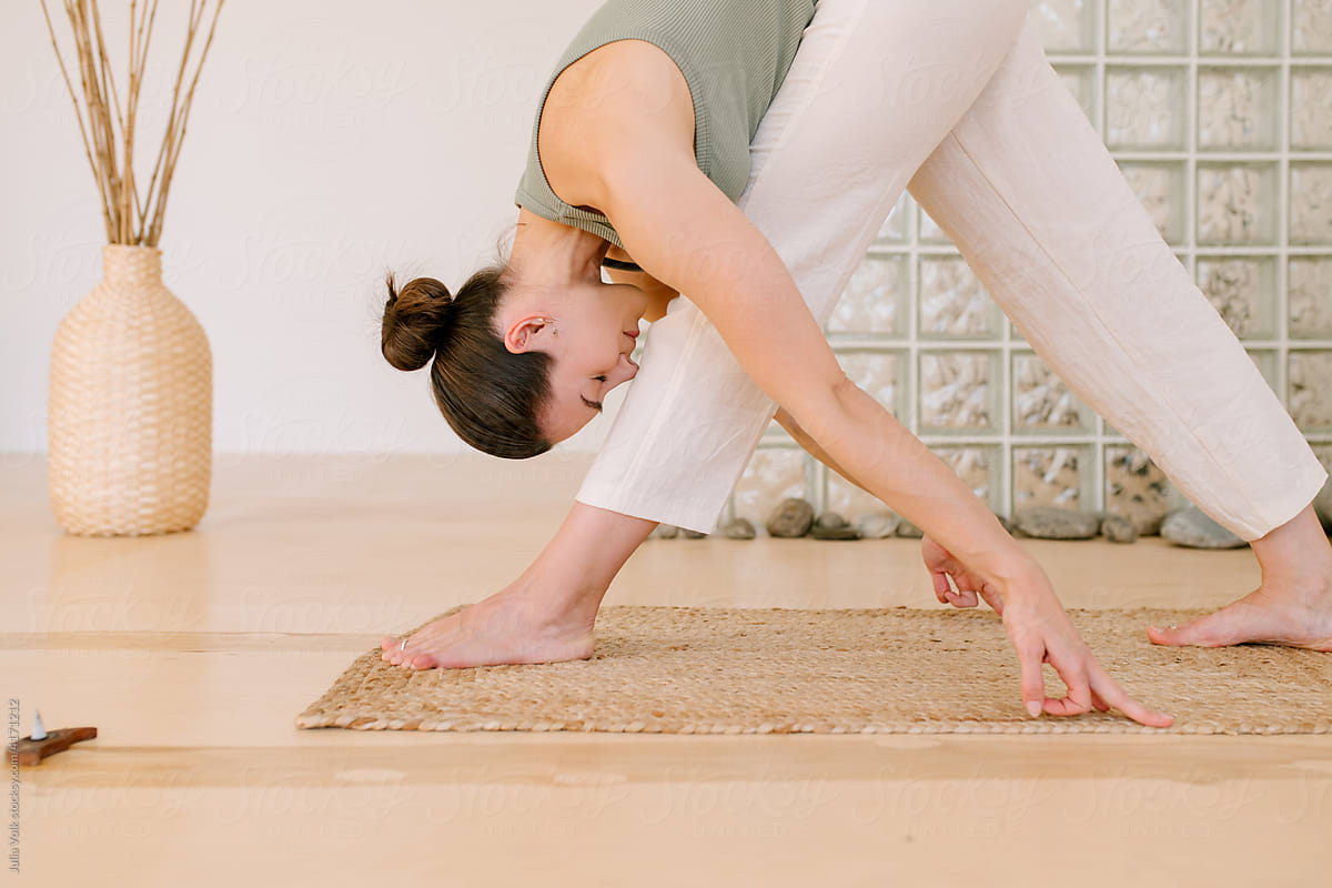 Flexible Woman Doing Pyramid Yoga Pose