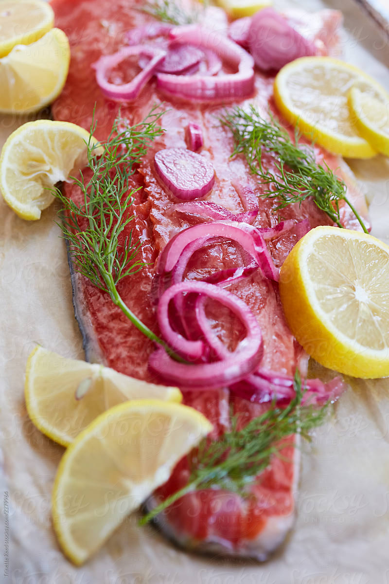 Closeup of baked salmon with pickled onions