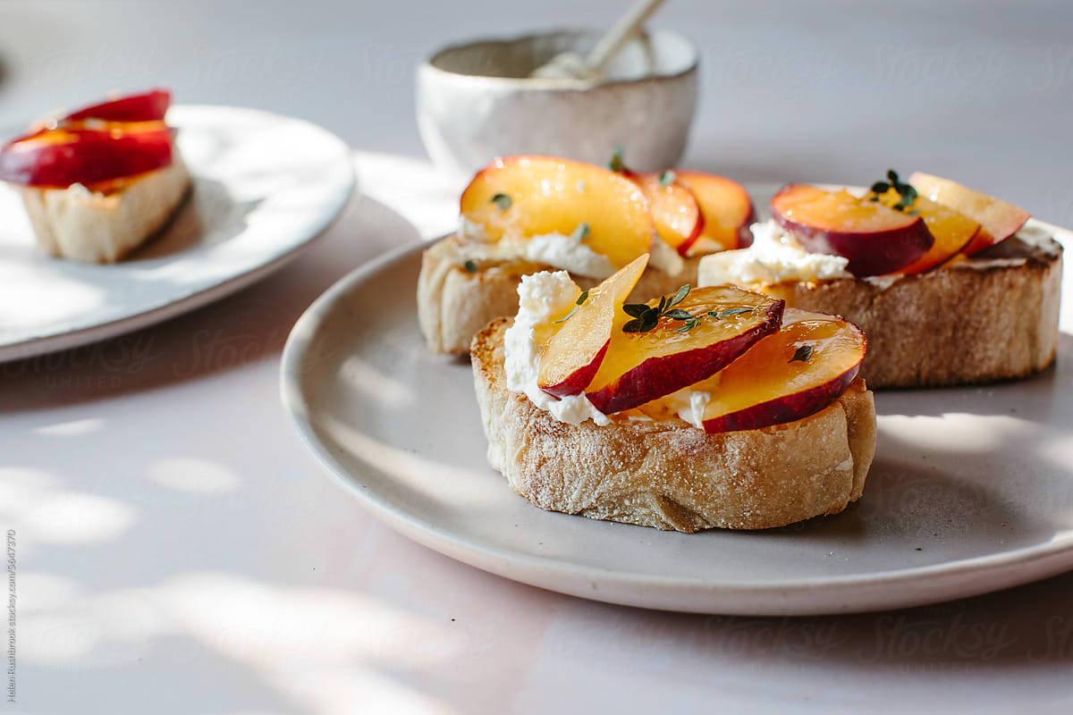 Toasted ciabatta with plums and cream cheese.