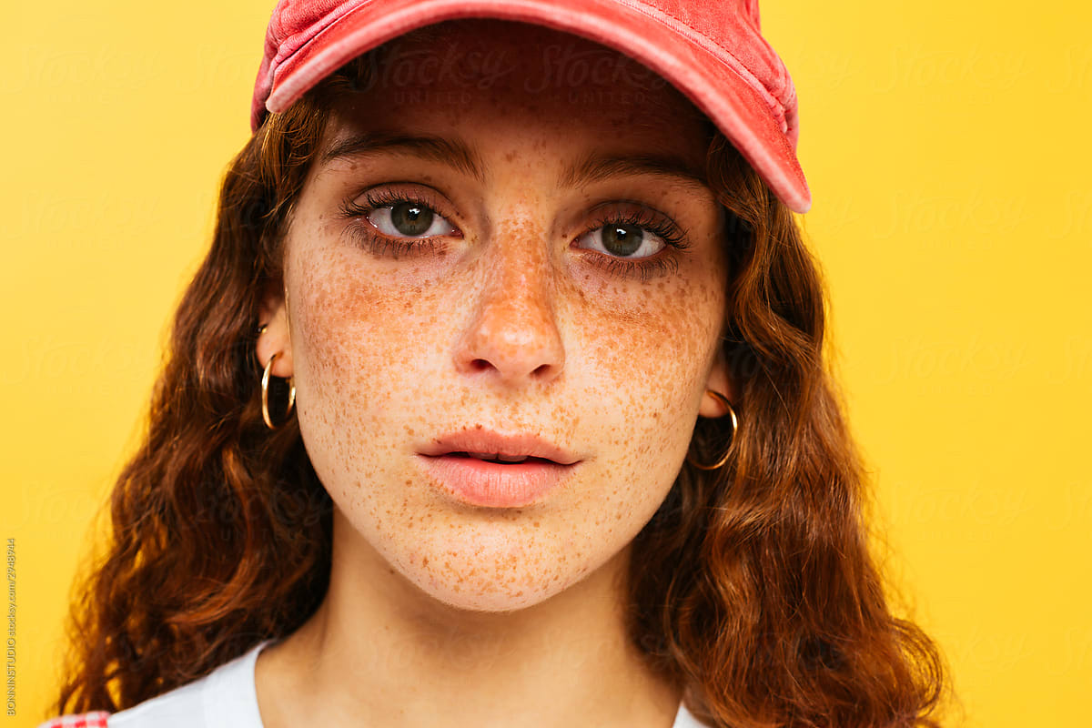 Ginger Teen Girl With Freckles Looking At Camera by BONNINSTUDIO photo image