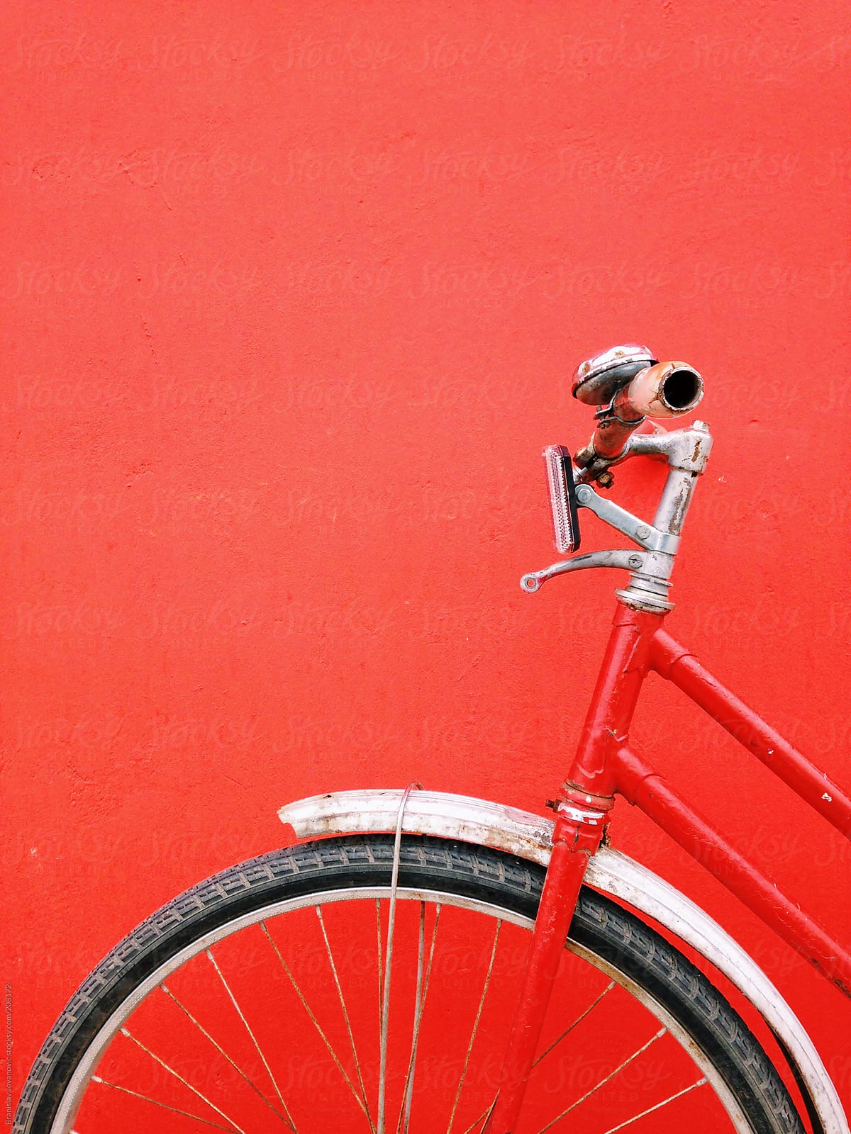 Close-up of a retro bike on red background