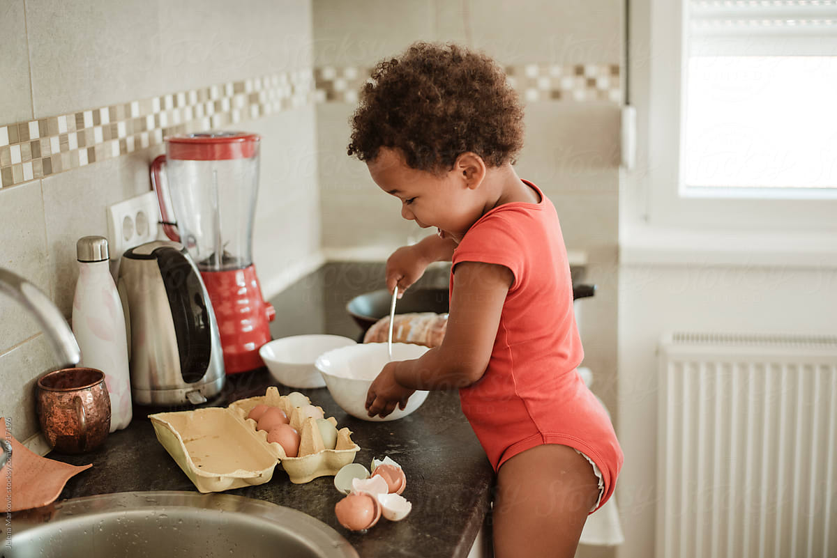 Toddler preparing breakfast