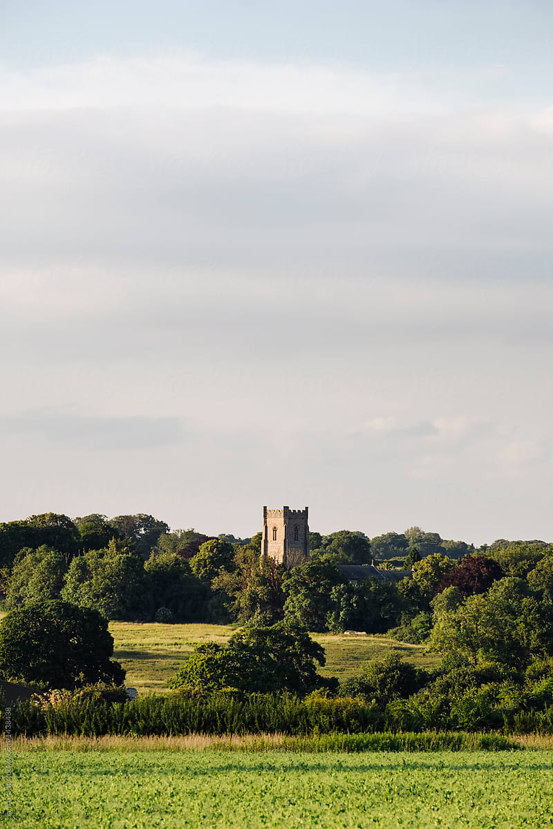 Church and surrounding countryside in evening light. Castle Acre