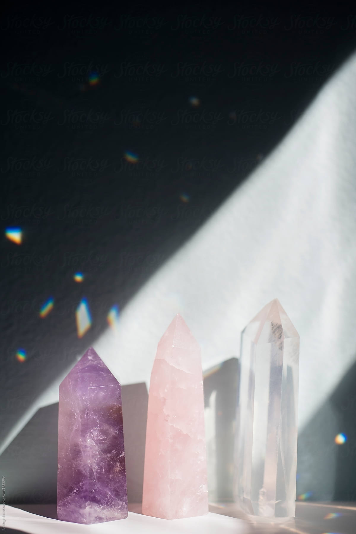 Crystals in beam of light creating rainbows