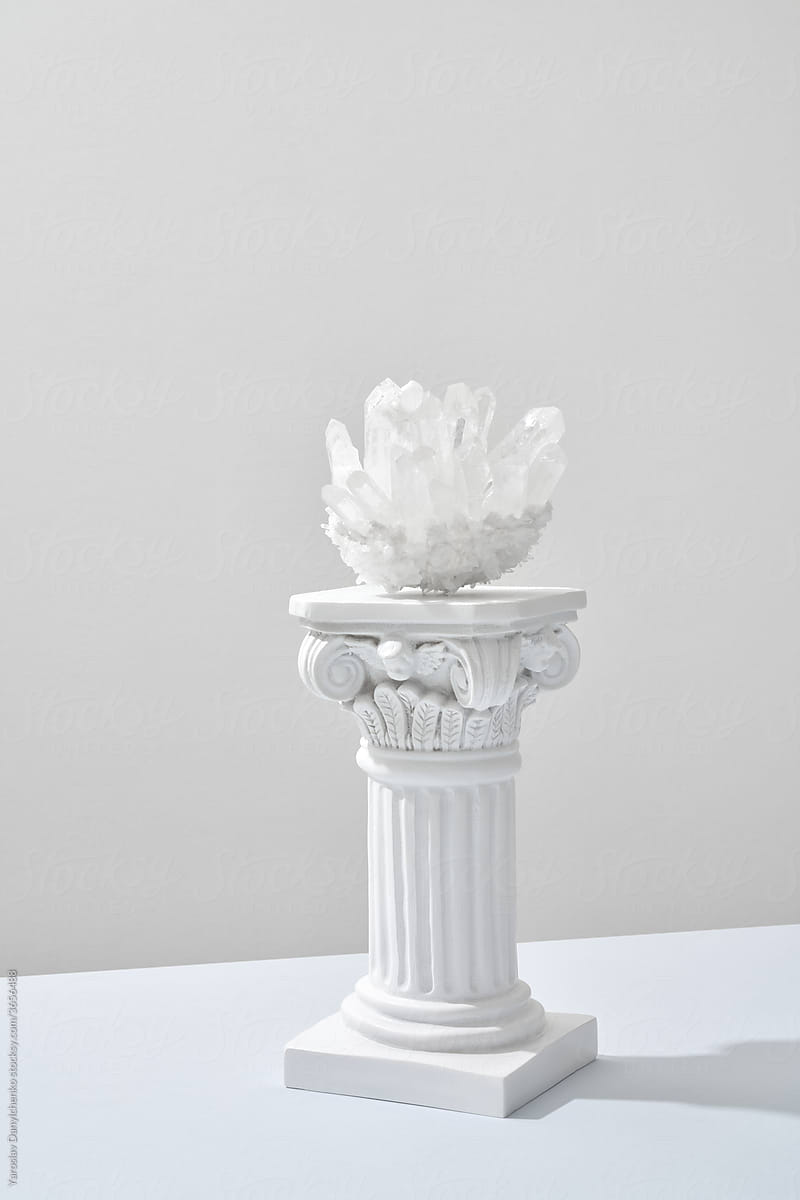 Shiny healing white quartz crystals on column