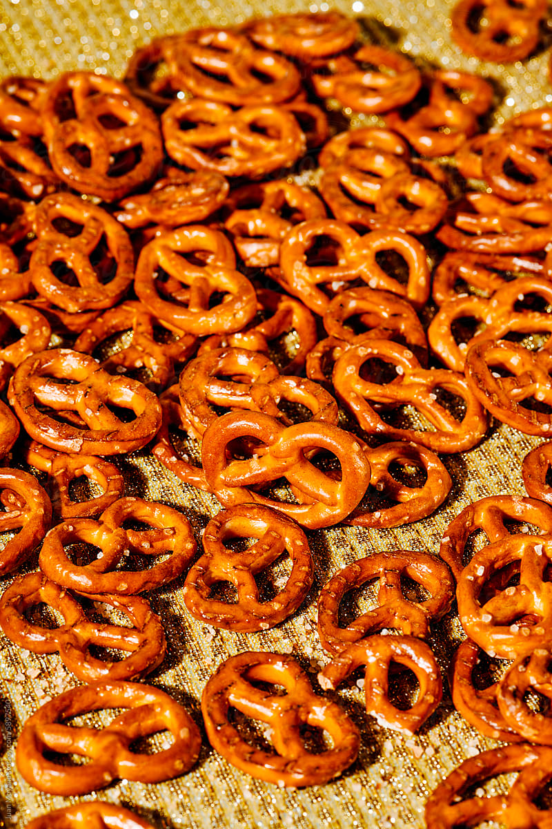 hard mini pretzels on a golden surface
