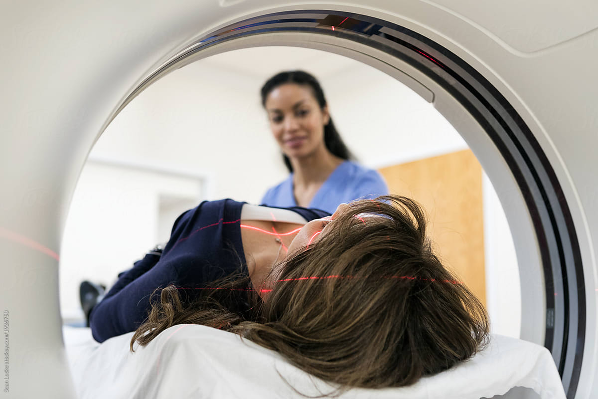 Clinic: Female Nurse Comforts Patient Prior To Scan