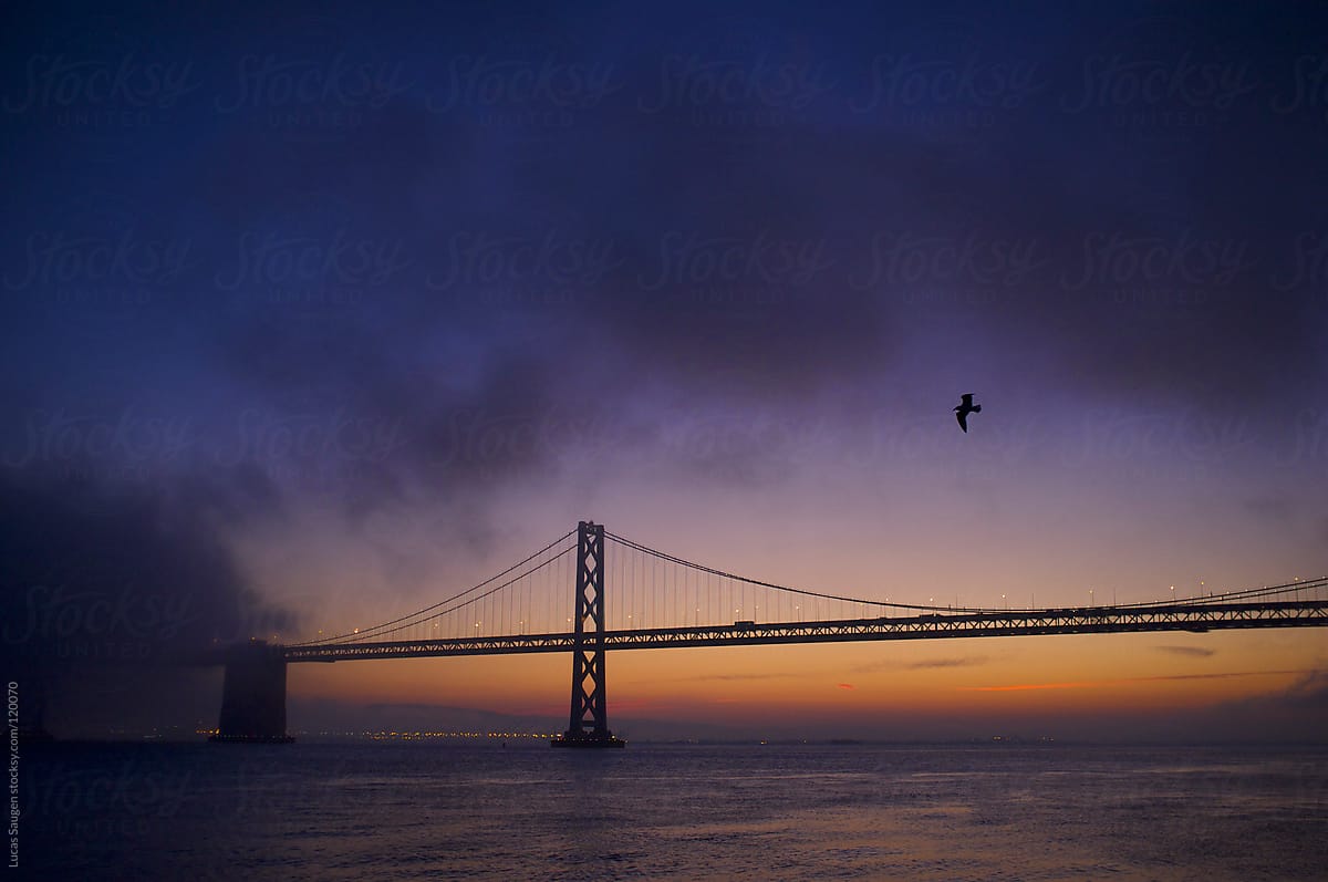 Fog rolling in over the San Francisco Bay Bridge.