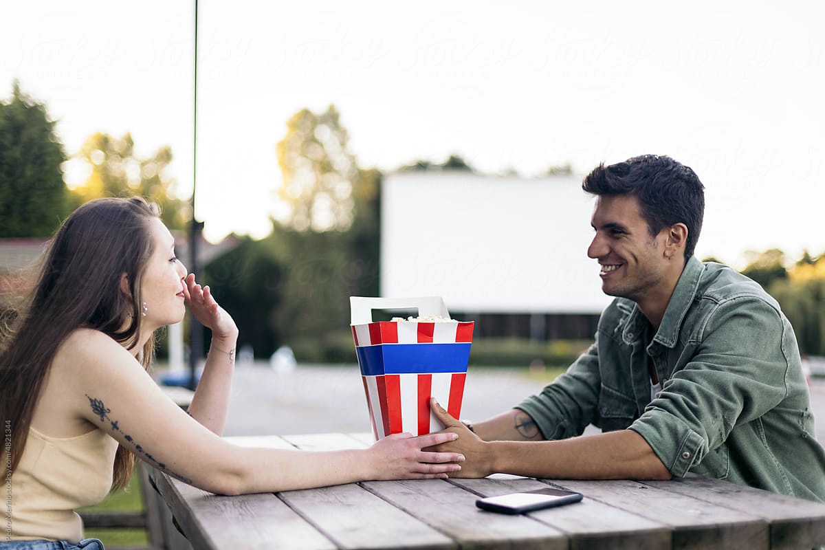 Couple at an outdoor drive-in movie theater