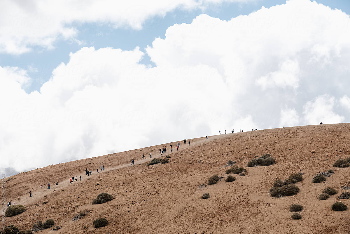 Distance view on many peoples going up on high mountain.