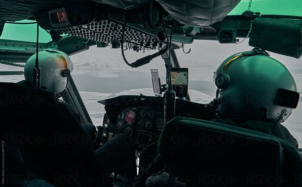 Greenland winter travel, helicopter cockpit pilots - Arctic aviation