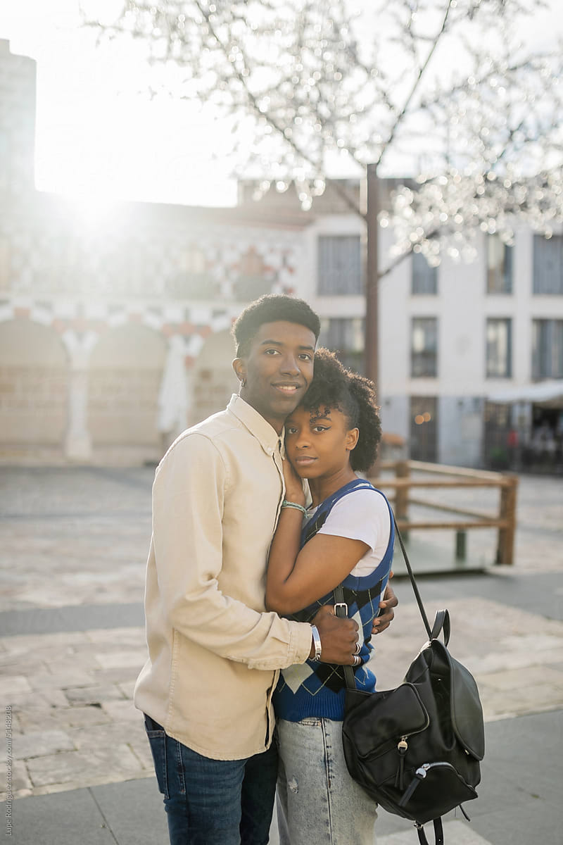 young black couple in love embracing in the city
