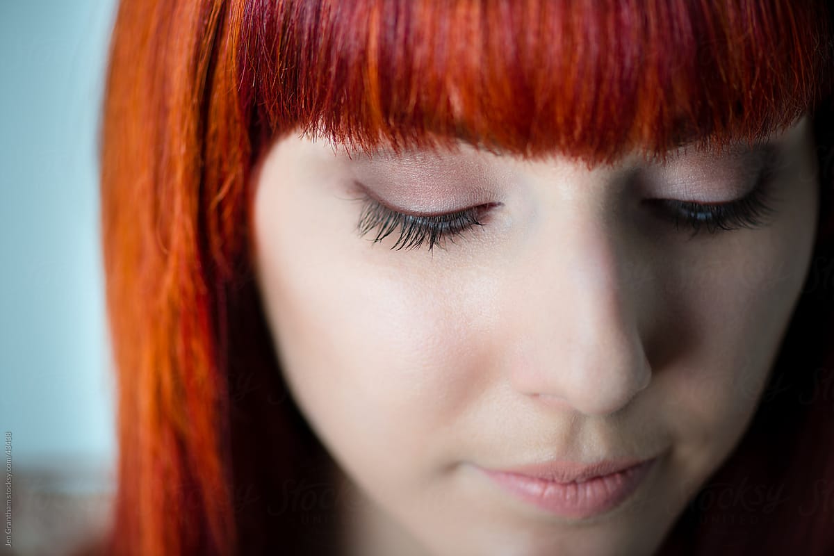 Close up of young woman with red hair